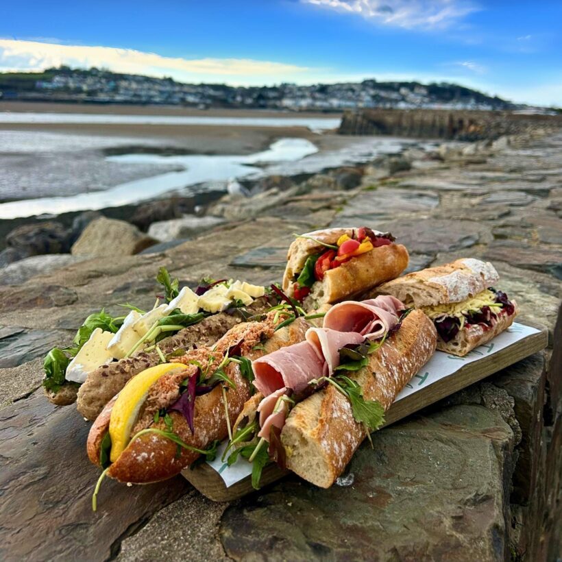 Freshly-made Johns baguettes on the counter, baked on the Appledore premises